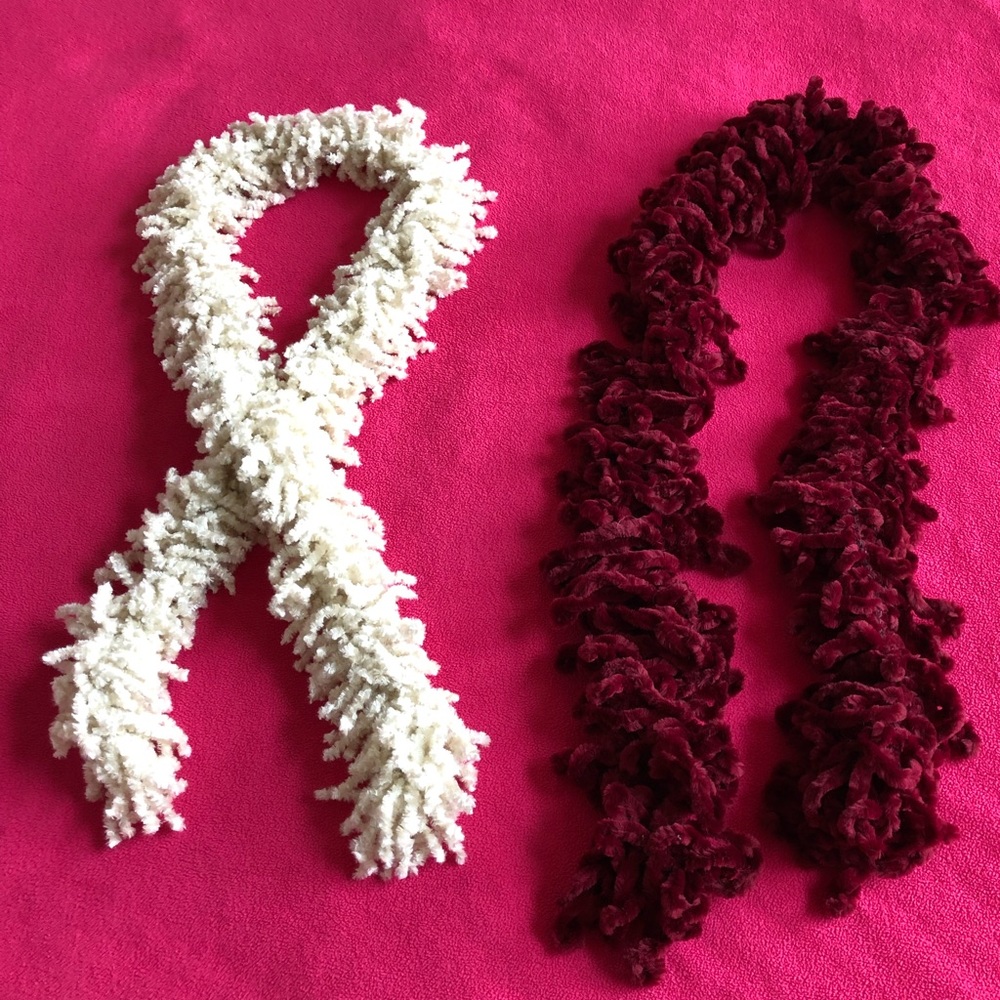Fuzzy set of two maroon and white scarves